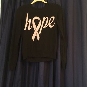 Black sweater with pink text